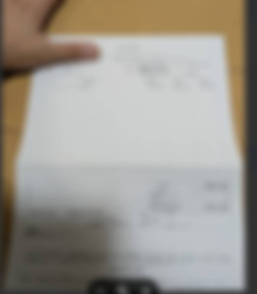 受領した領収書（モザイク処理済み）